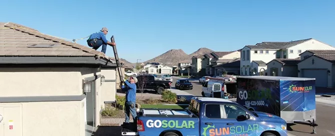 solar installers installing panels on a home