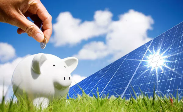 piggy bank in front of solar panels